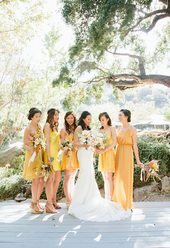 mismatching yellow mini, knee and maxi bridesmaid dresses are a cool idea for a spring or summer wedding