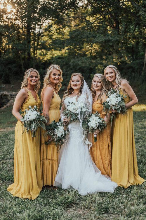 pretty mismatching maxi yellow bridesmaid dresses for a spring or summer boho wedding