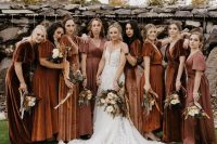 rust, brown and mauve mismatching maxi bridesmaid dresses for a formal fall or winter wedding