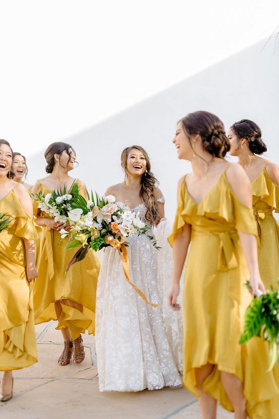 yellow cold shoulder high low bridesmaid dresses for a bright summer or spring wedding