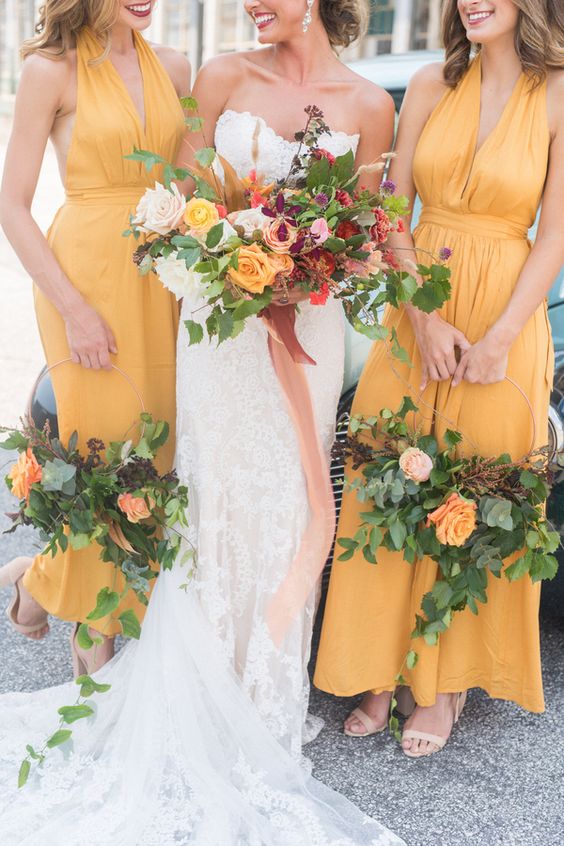 yellow maxi bridesmaid dresses with halter necklines and nude shoes are a cool solution for a summer wedding