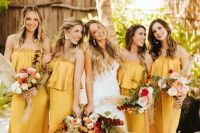 yellow strapless maxi bridesmaid dresses with a tiered bodice are very cool and they add to the tropical theme
