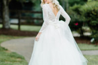 02 The bride was wearing a ball gown dress with a tulle skirt and a lace top