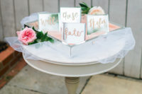 The mini place cards are mirror ones with pink frosting
