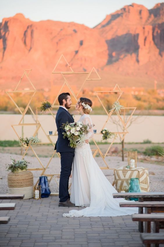 wooden plank triangle backdrop for a desert wedding