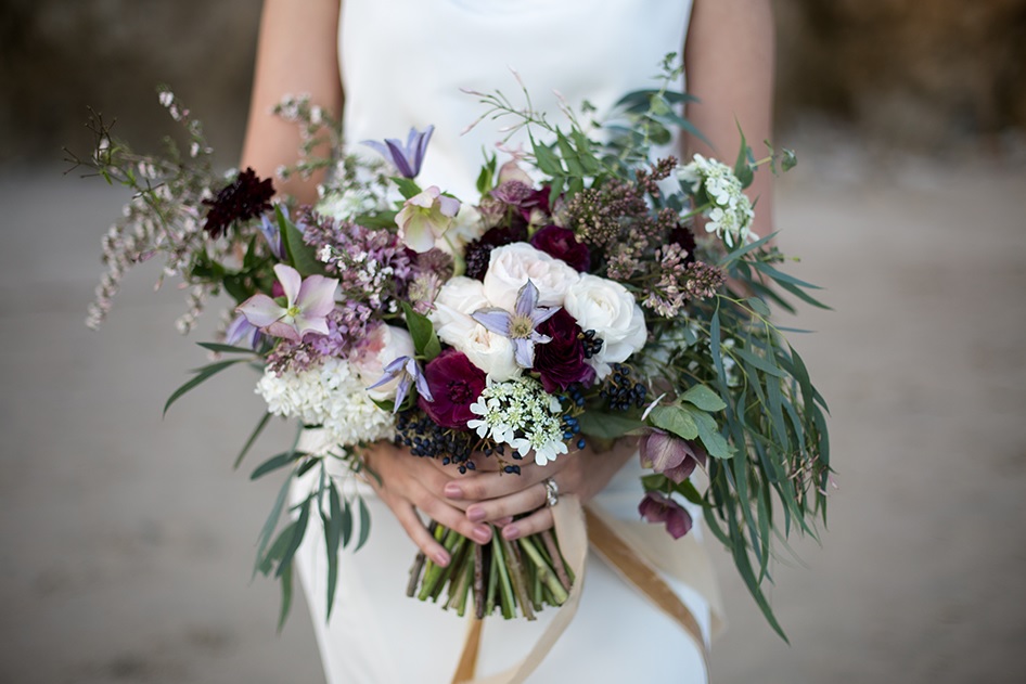 The bouquet was done in the shades of purple and blush, it's boho and relaxed