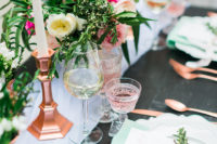 The table setting is done in rose gold and fresh mint, there is a lot of greenery, blush and fuchsia flowers
