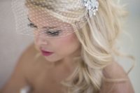 05 birdcage veil with a rhinestone comb and long hair down