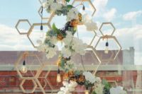 05 wooden honey comb backdrop with fresh flowers and bulbs for an industrial wedding