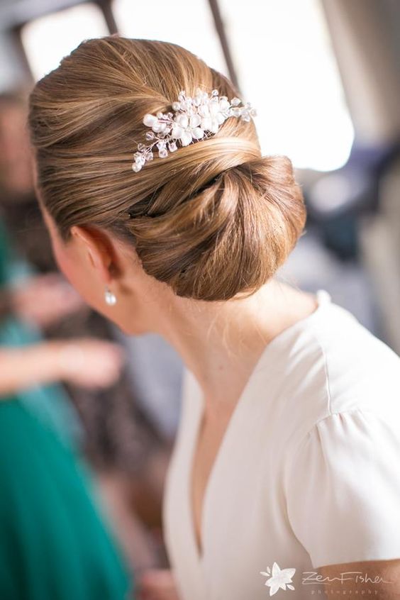 such a bridal chignon will look good in case you won't have a cover up, which may spoil it