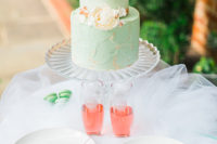 The wedding cake was done in mint, and the cake topper is gold