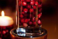 08 glass with cranberries and a floating candle is a simple centerpiece