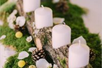 08 rustic wooden candle holder placed on moss