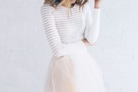 a tulle maxi skirt with edging and a white sweater are a creative and out of the box combo for a bridal shower