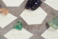 11 rocks for keeping cards in place will help you to pull off the theme