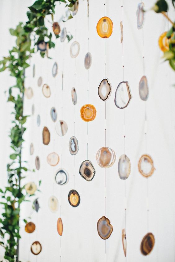 agate slice ceremony backdrop looks awesome infront of white walls