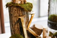 12 moss, logs and candles for decorating tables