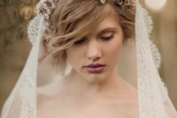 14 mantilla lace veil accessorized with a flower crown