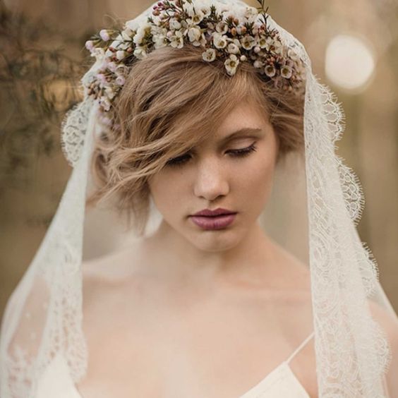 mantilla lace veil accessorized with a flower crown