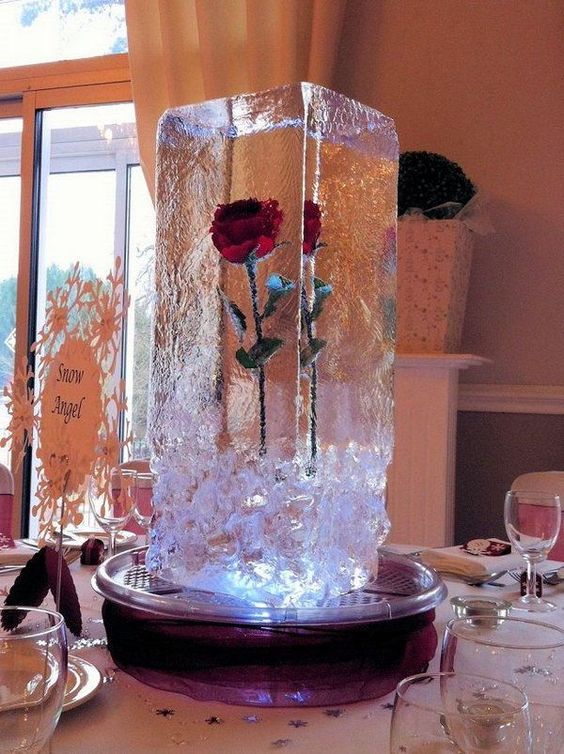frozen rose in an ice cube is a perfect centerpiece for winter weddings