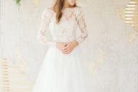 A line and illusion neckline lace top and a tulle skirt