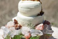 16 a geode cake topper and crystals for decor are great for a boho or rustic wedding
