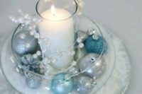 16 icy blue and silver wedding centerpiece with a candle