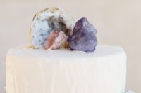 17 a plain wedding cake can be decorated with geodes or agates to make a statement