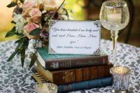 18 place a stack of classic love stories on each table, with a framed quote on top