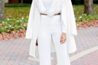 a chic and glam all-white look with wide leg pants, a crop top, faux fur and a jacket is lovely for a winter bridal shower