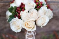 19 white flowers and cranberries are a simple yet chic combo for a winter bouquet