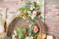 21 boho basket filled with florals and greenery as a wedding decoration