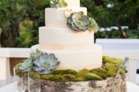 21 moss and succulents give this cake a forest-inspired look