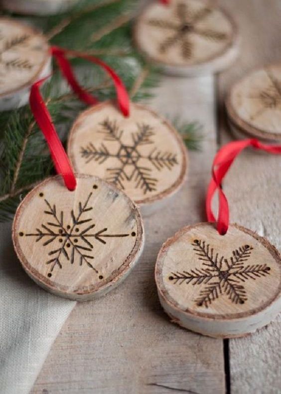burnt snowflake wood slices as winter ornaments