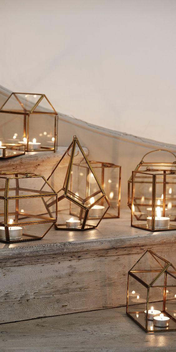 copper geo lanterns in various shapes to decorate the ceremony
