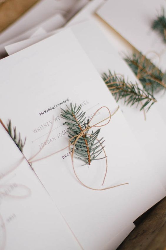 decorate menus and programs with fir branches for a cozy touch