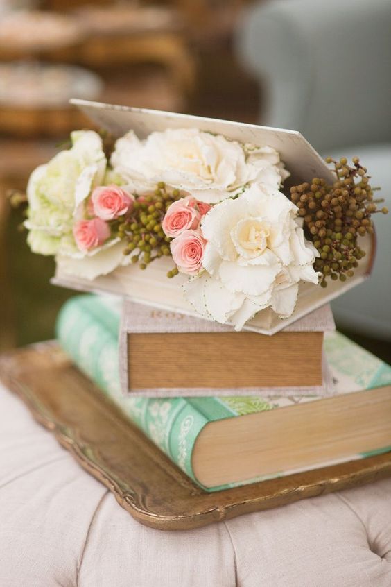 stacked books and a planter atop work as a cool centerpiece