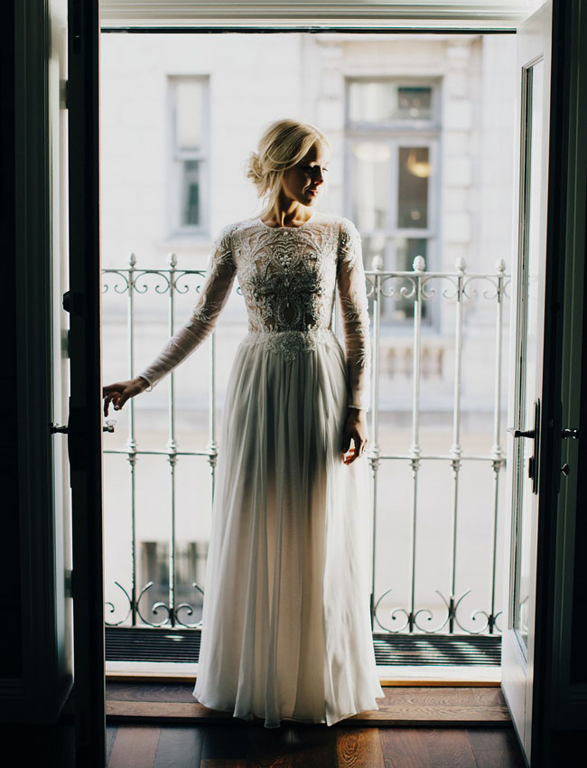 long sleeve dress with a beaded bodice and a flowing skirt is perfect for a relaxed wedding