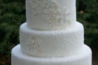 24 white fondant with sanding sugar and white snowflakes