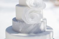 25 elegant pure white wedding cake with white flowers and a textural grey layer