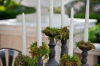 25 moss in candle holders to prevent wax on the table