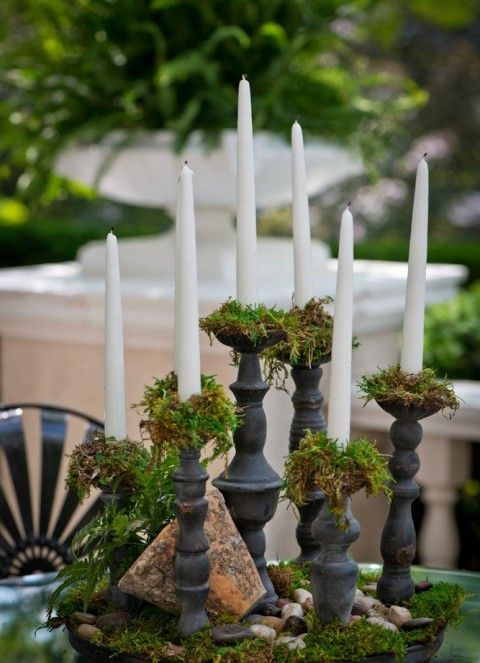 moss in candle holders to prevent wax on the table