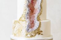 25 pink geode and gold leaf wedding cake looks like a real rock piece
