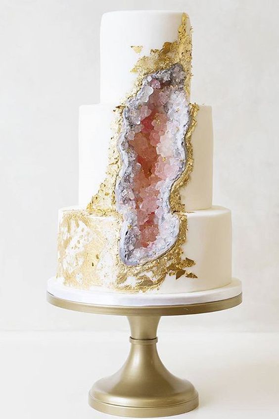pink geode and gold leaf wedding cake looks like a real rock piece