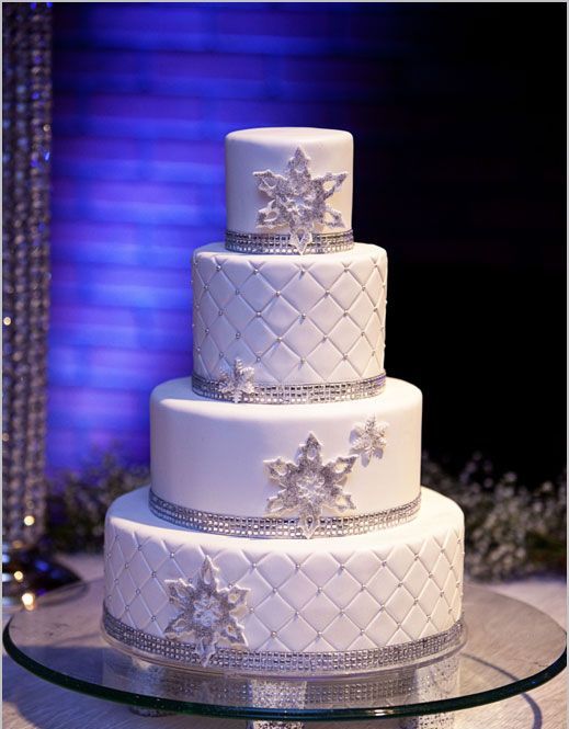glamorous winter wedding cake with silver and snowflakes