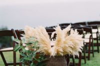 27 pampas grass in a wicker basket for the end of aisle details