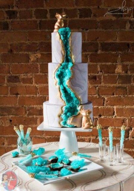 turquoise geode decor makes a bold statement on the cake