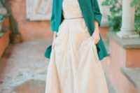 30 emerald coat creates a bold accent and highlights the vintage look of the bride