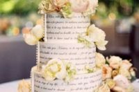 31 book page three tier cake decorated wwith neutral flowers