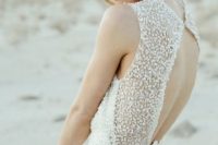 33 pearls all over the bodice will highlight that it’s a coastal wedding